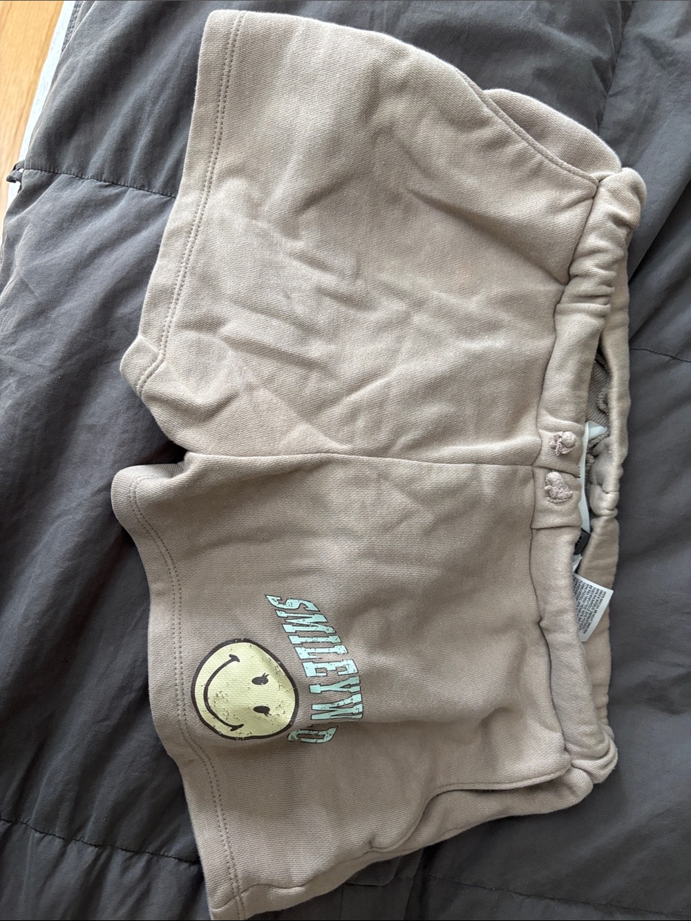 H&M Beige Shorts with Smiley Face Graphic